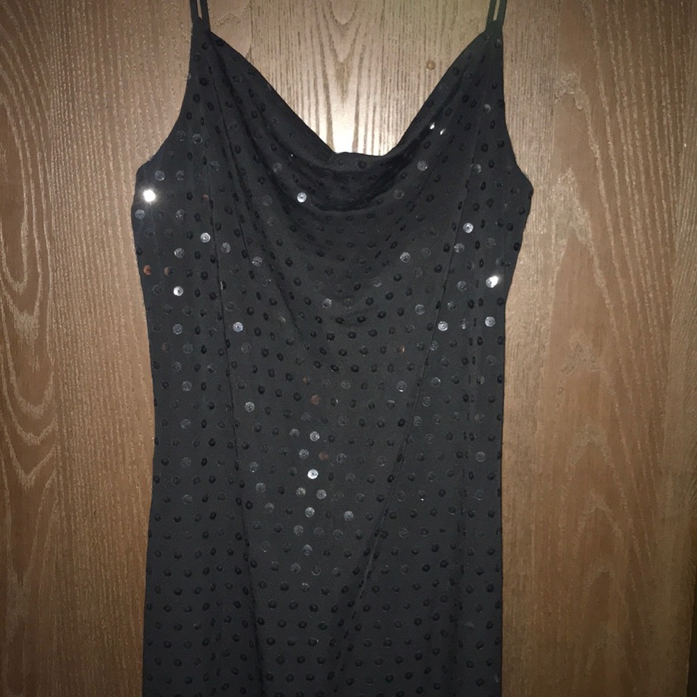Floor-length black sequence dress.